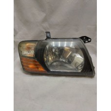 Headlight Right for Mitsubishi Pajero Wagon 3 Halogen, Black since 2000 used Europe Original MR548034